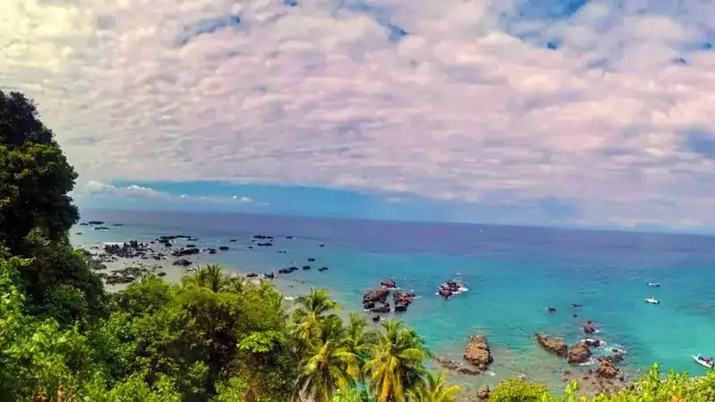 Rocky shore and blue water at Caño Island